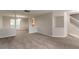 View of an open-concept living area with plush carpet and natural light at 2191 Phillips Rd, Lithonia, GA 30058