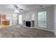 Open concept living room leading to the kitchen with a fireplace at 2191 Phillips Rd, Lithonia, GA 30058