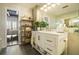 Bathroom featuring a white vanity, marble countertops, gold shelving, and tile floors at 3235 Roswell Ne Rd # 402, Atlanta, GA 30305