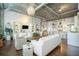 Spacious living area with white furnishings flowing seamlessly into the open kitchen with bar seating at 3235 Roswell Ne Rd # 402, Atlanta, GA 30305