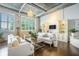 Bright, open living space with exposed pipes, hardwood floors, and large windows allowing natural light to flood in at 3235 Roswell Ne Rd # 402, Atlanta, GA 30305