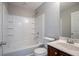 Bright bathroom features a tub and single sink vanity at 2482 Brittany Park Ln, Ellenwood, GA 30294