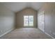 Bedroom featuring neutral carpet, vaulted ceilings, and natural lighting at 2482 Brittany Park Ln, Ellenwood, GA 30294