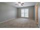 Carpeted bedroom with one window and a ceiling fan at 2482 Brittany Park Ln, Ellenwood, GA 30294