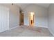 Carpeted bedroom with access to bathroom and closet at 2482 Brittany Park Ln, Ellenwood, GA 30294