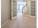 Bonus room featuring french doors and view to stairs at 2482 Brittany Park Ln, Ellenwood, GA 30294