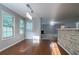 Bright dining area with hardwood floors and pendant lighting adjacent to the open living space at 2482 Brittany Park Ln, Ellenwood, GA 30294