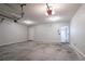 Two car garage featuring a large interior space with an interior door and two garage doors at 2482 Brittany Park Ln, Ellenwood, GA 30294