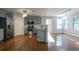 Modern kitchen featuring stainless steel appliances, gray cabinetry, and hardwood floors at 2482 Brittany Park Ln, Ellenwood, GA 30294