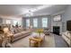Inviting living room with fireplace and ample seating for Gathering and friends at 2482 Brittany Park Ln, Ellenwood, GA 30294