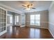 Elegant living room with hardwood floors, natural light, and glass paneled doors at 2482 Brittany Park Ln, Ellenwood, GA 30294