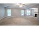 Spacious living room with natural light and adjacent to a fireplace at 2482 Brittany Park Ln, Ellenwood, GA 30294