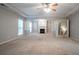 Spacious living room features columns, natural light and a fireplace at 2482 Brittany Park Ln, Ellenwood, GA 30294