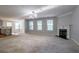 Open living space featuring a fireplace and lots of natural light at 2482 Brittany Park Ln, Ellenwood, GA 30294