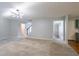 Open floor plan with a staircase leading to the upper level, great for entertaining at 2482 Brittany Park Ln, Ellenwood, GA 30294