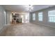 Bright and airy living room with seamless flow into the kitchen, perfect for gatherings at 2482 Brittany Park Ln, Ellenwood, GA 30294