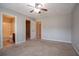 Spacious carpeted main bedroom with an en-suite bathroom at 2482 Brittany Park Ln, Ellenwood, GA 30294