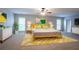 Main bedroom with large windows, a ceiling fan, and en suite bathroom at 2482 Brittany Park Ln, Ellenwood, GA 30294