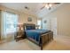 Comfortable bedroom featuring a vaulted ceiling, ceiling fan, and a cozy bed with a blue comforter at 2870 Jay Oak Dr, Dacula, GA 30019