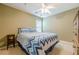 Cozy bedroom with a comfortable bed, ceiling fan, and neutral decor providing a serene atmosphere at 2870 Jay Oak Dr, Dacula, GA 30019