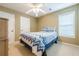 Bedroom with neutral walls and ceiling fan with modern bed design at 2870 Jay Oak Dr, Dacula, GA 30019