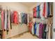 Walk-in closet with ample storage space and metal rods for hanging clothes and accessories at 2870 Jay Oak Dr, Dacula, GA 30019