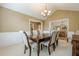 Dining room with chandelier and seating for eight, open to other living spaces at 2870 Jay Oak Dr, Dacula, GA 30019