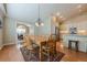 Dining room with view into kitchen featuring stainless steel appliances at 2870 Jay Oak Dr, Dacula, GA 30019
