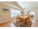 Dining room with wood table, light fixture, and hardwood floors at 2870 Jay Oak Dr, Dacula, GA 30019