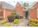 Inviting brick home featuring manicured shrubbery and a welcoming entrance at 2870 Jay Oak Dr, Dacula, GA 30019