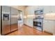 Stainless steel appliances, granite countertops and hardwood floors in kitchen at 2870 Jay Oak Dr, Dacula, GA 30019