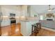 Open concept kitchen with granite counters, stainless appliances, and breakfast bar at 2870 Jay Oak Dr, Dacula, GA 30019