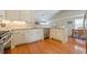 Charming kitchen features granite counters, stainless steel appliances, and hardwood flooring at 2870 Jay Oak Dr, Dacula, GA 30019