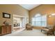 Cozy living room features neutral walls, large windows and comfortable seating area at 2870 Jay Oak Dr, Dacula, GA 30019