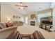 Comfortable living room features a fireplace, neutral walls and carpet, and natural light at 2870 Jay Oak Dr, Dacula, GA 30019