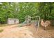 Backyard storage shed next to a playground set at 2870 Jay Oak Dr, Dacula, GA 30019