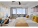 Bright bedroom featuring hardwood floors, modern artwork, and a balcony with scenic treetop views at 3630 Peachtree Ne Rd # 2309, Atlanta, GA 30326