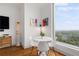 Cozy dining area with white table and chairs near a large window with expansive views at 3630 Peachtree Ne Rd # 2309, Atlanta, GA 30326