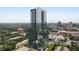 Modern high-rise building surrounded by city views and lush green landscape at 3630 Peachtree Ne Rd # 2309, Atlanta, GA 30326