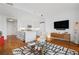 Stylish condo with open floor plan, wood floors, kitchen island seating, and modern furnishings at 3630 Peachtree Ne Rd # 2309, Atlanta, GA 30326