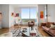 Bright living space with hardwood floors, modern furnishings, and expansive windows at 3630 Peachtree Ne Rd # 2309, Atlanta, GA 30326