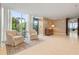 Elegant lobby featuring comfortable seating, stylish decor, and access to outdoor garden area with lush greenery at 3630 Peachtree Ne Rd # 2309, Atlanta, GA 30326