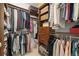 Custom walk-in closet featuring ample storage and organization with dual hanging rods and built-in drawers at 3630 Peachtree Ne Rd # 2309, Atlanta, GA 30326