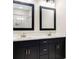 This primary bathroom features dual sinks and a dark vanity at 415 Paynes Lake Rd, Carrollton, GA 30116