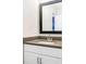 Bathroom featuring a gray countertop, modern fixtures, and a sleek mirror, combining style with functionality at 415 Paynes Lake Rd, Carrollton, GA 30116