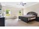 This spacious bedroom features a ceiling fan and natural light at 415 Paynes Lake Rd, Carrollton, GA 30116