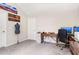 Room with desk, office chair, computer, and dress form at 415 Paynes Lake Rd, Carrollton, GA 30116