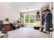 Bright room with large window, desk, shelving, and dress form at 415 Paynes Lake Rd, Carrollton, GA 30116
