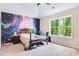 Bedroom featuring a unique accent wall and a window at 415 Paynes Lake Rd, Carrollton, GA 30116