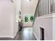 Welcoming foyer with a staircase, hardwood floors, and a view of the front doors adorned with wreaths at 415 Paynes Lake Rd, Carrollton, GA 30116